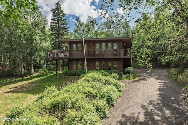 11851 Nebesna Dr, Anchorage, AK 99507 - back of house with a deck, a yard, and driveway