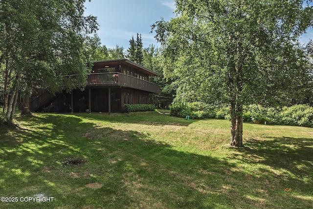 11851 Nebesna Dr, Anchorage, AK 99507 - view of green lawn featuring a deck and stairway