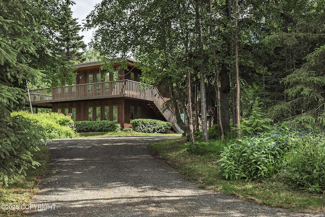 11851 Nebesna Dr, Anchorage, AK 99507 - view of front facade with a deck, stairs, and driveway