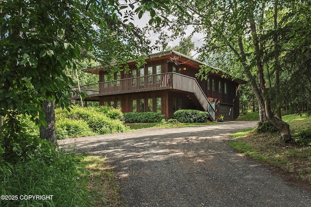 11851 Nebesna Dr, Anchorage, AK 99507 - view of front of property featuring dirt driveway, a wooden deck, and stairway