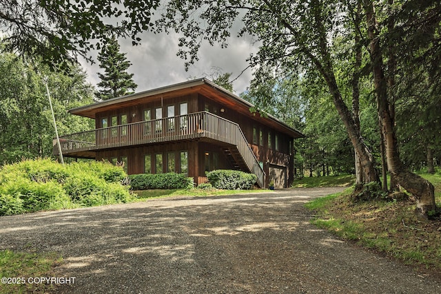 11851 Nebesna Dr, Anchorage, AK 99507 - view of front of property featuring driveway, a wooden deck, and stairway