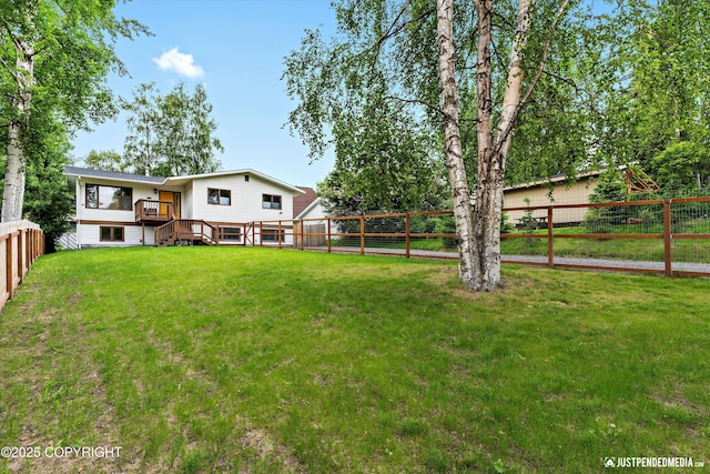 6922 Cutty Sark St, Anchorage, AK 99502 - fenced backyard with a wooden deck and stairway