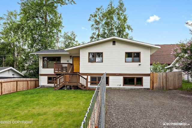 6922 Cutty Sark St, Anchorage, AK 99502 - view of front of property featuring a fenced backyard, stairway, and a wooden deck