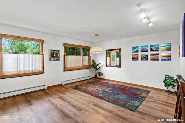 6922 Cutty Sark St, Anchorage, AK 99502 - spare room with a baseboard radiator and wood finished floors