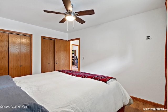 6922 Cutty Sark St, Anchorage, AK 99502 - bedroom featuring wood finished floors, multiple closets, and a ceiling fan