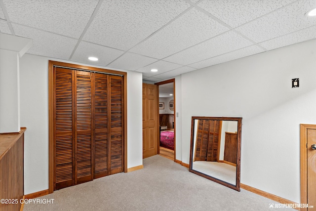 6922 Cutty Sark St, Anchorage, AK 99502 - unfurnished bedroom featuring carpet, a closet, a paneled ceiling, and recessed lighting