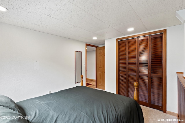 6922 Cutty Sark St, Anchorage, AK 99502 - carpeted bedroom with a closet, a drop ceiling, and recessed lighting