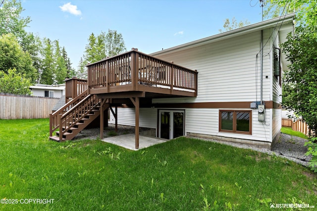 6922 Cutty Sark St, Anchorage, AK 99502 - back of property with a wooden deck, stairway, and a patio area