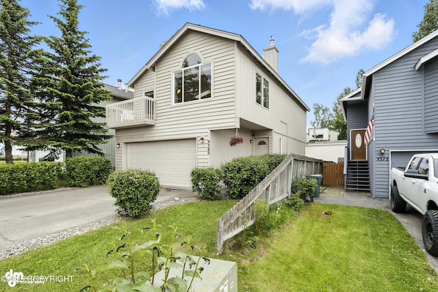 9380 Sea Parrot Cir, Anchorage, AK 99515 - view of front of house with a garage, a chimney, driveway, and a front lawn