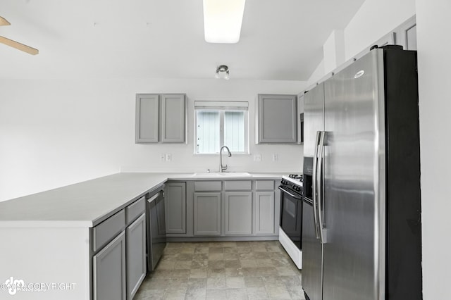 9380 Sea Parrot Cir, Anchorage, AK 99515 - kitchen featuring stainless steel appliances, gray cabinetry, a peninsula, and light countertops