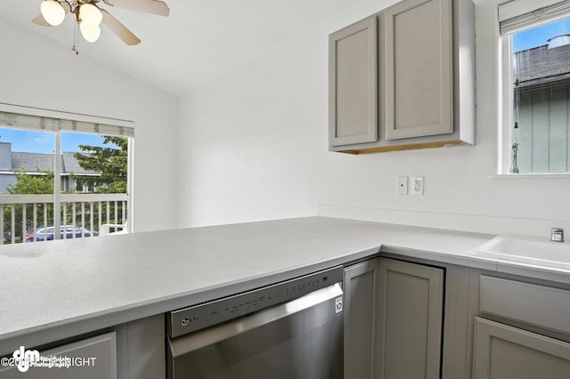 9380 Sea Parrot Cir, Anchorage, AK 99515 - kitchen featuring stainless steel dishwasher, gray cabinetry, lofted ceiling, healthy amount of natural light, and light countertops