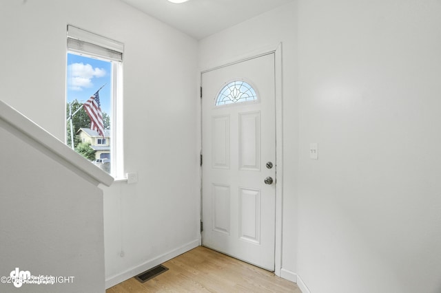 9380 Sea Parrot Cir, Anchorage, AK 99515 - entryway featuring light wood-style floors and baseboards