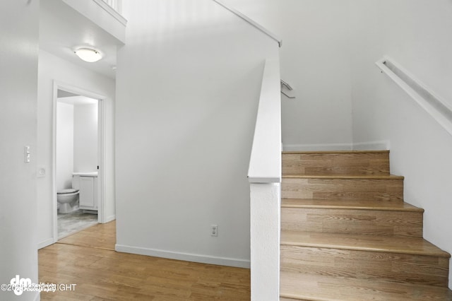9380 Sea Parrot Cir, Anchorage, AK 99515 - stairs with wood finished floors and baseboards