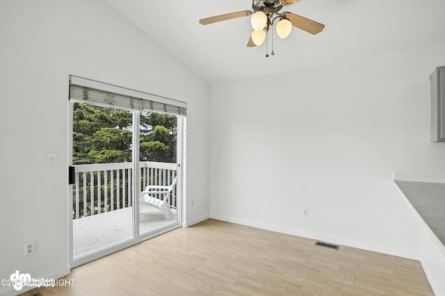 9380 Sea Parrot Cir, Anchorage, AK 99515 - empty room with a ceiling fan, wood finished floors, and lofted ceiling