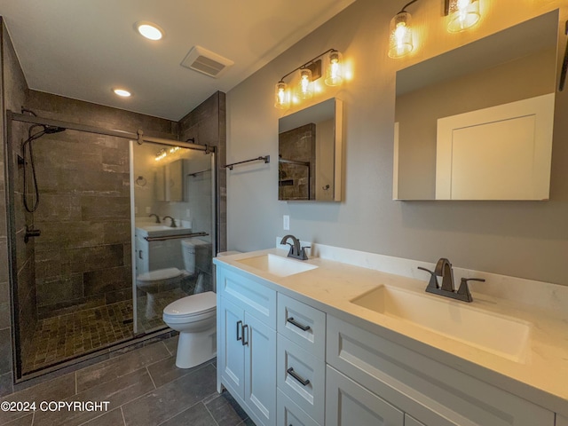 3715 Tajen Ln, Homer, AK 99603 - bathroom with double vanity, a shower stall, and recessed lighting
