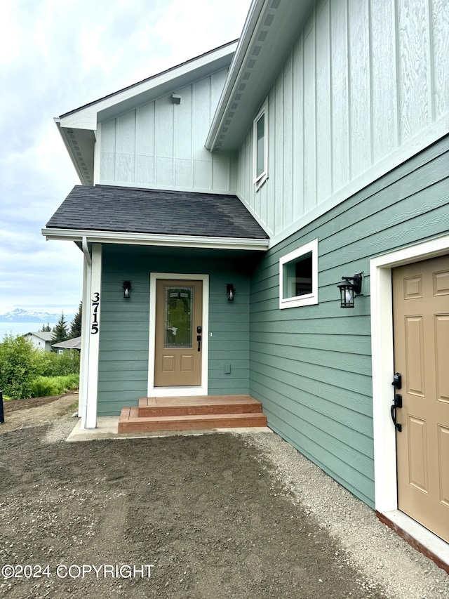 3715 Tajen Ln, Homer, AK 99603 - doorway to property featuring board and batten siding and a shingled roof
