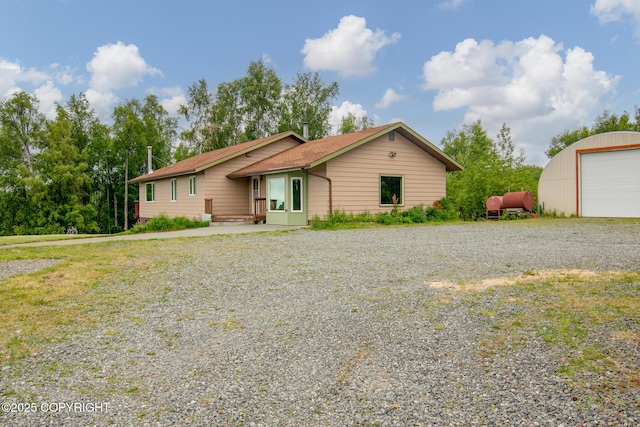 40800 Lopez Ave, Soldotna, AK 99669 - ranch-style house with driveway, an outdoor structure, and a detached garage