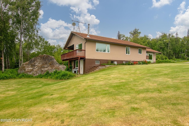 40800 Lopez Ave, Soldotna, AK 99669 - back of house with a wooden deck, a lawn, and stairs