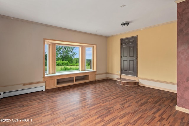 40800 Lopez Ave, Soldotna, AK 99669 - spare room featuring wood finished floors, crown molding, and a baseboard heating unit