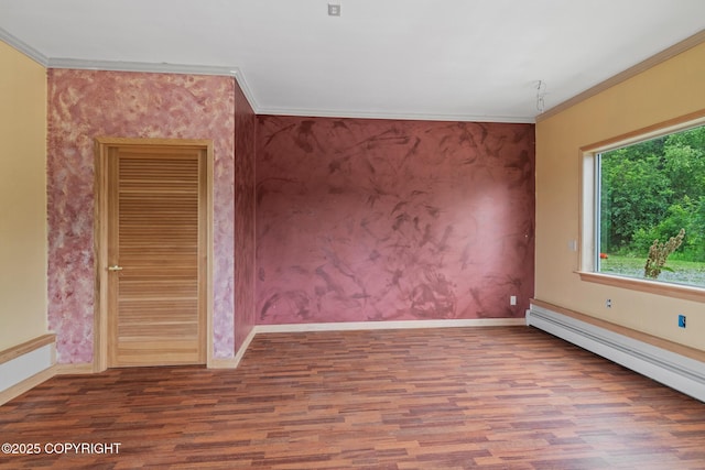 40800 Lopez Ave, Soldotna, AK 99669 - spare room with wood finished floors, a baseboard radiator, and crown molding