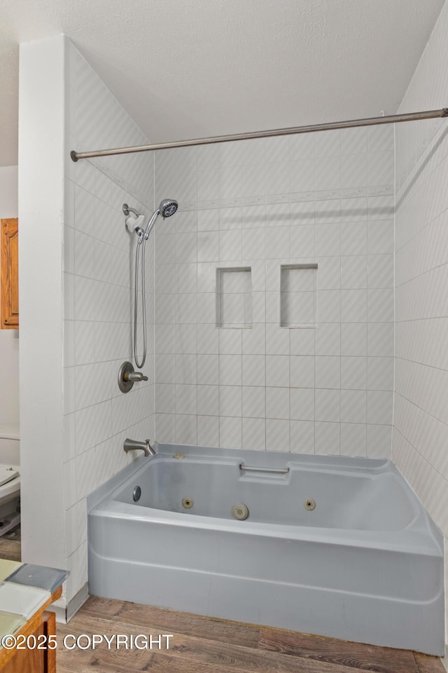 40800 Lopez Ave, Soldotna, AK 99669 - bathroom with a combined bath / shower with jetted tub, wood finished floors, and a textured ceiling