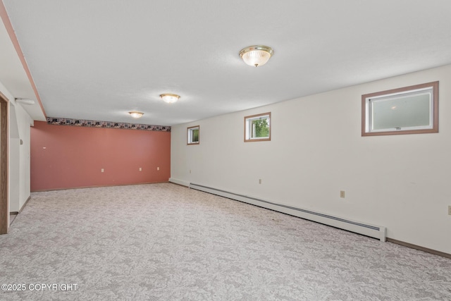 40800 Lopez Ave, Soldotna, AK 99669 - below grade area featuring a baseboard heating unit and carpet