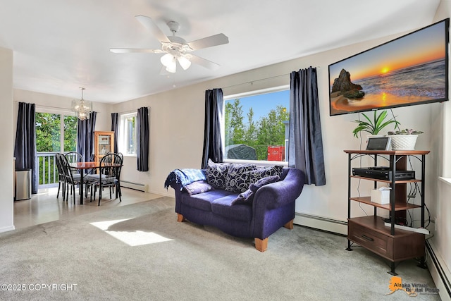 11929 W Wasey Cir, Houston, AK 99623 - living area featuring a chandelier, a baseboard radiator, and a ceiling fan
