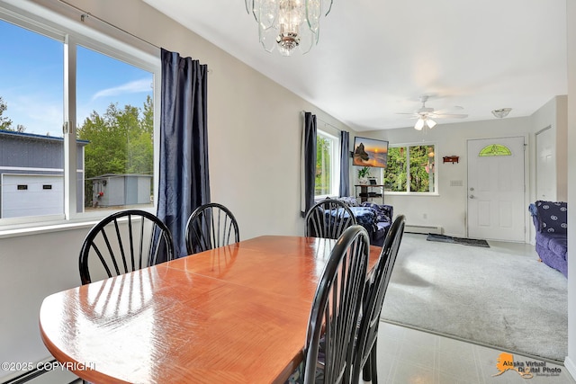 11929 W Wasey Cir, Houston, AK 99623 - dining room with baseboard heating, ceiling fan, and a chandelier