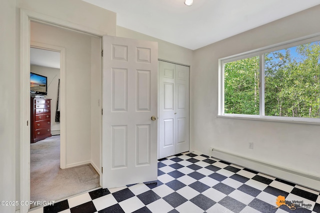11929 W Wasey Cir, Houston, AK 99623 - unfurnished bedroom featuring baseboard heating, light floors, and a closet