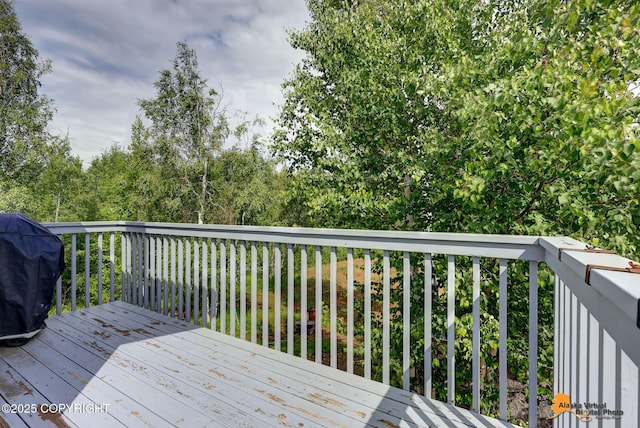 11929 W Wasey Cir, Houston, AK 99623 - wooden terrace with a grill