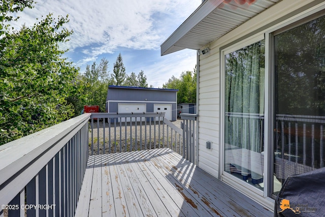 11929 W Wasey Cir, Houston, AK 99623 - wooden deck with an outbuilding and a detached garage