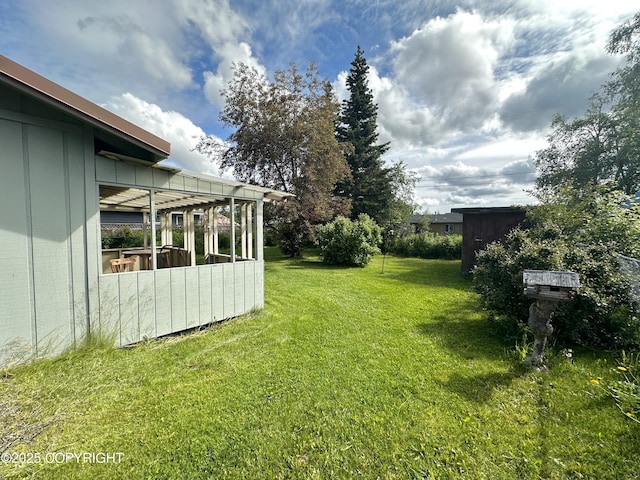 108 S Leibrock St, Soldotna, AK 99669 - view of grassy yard featuring a sunroom
