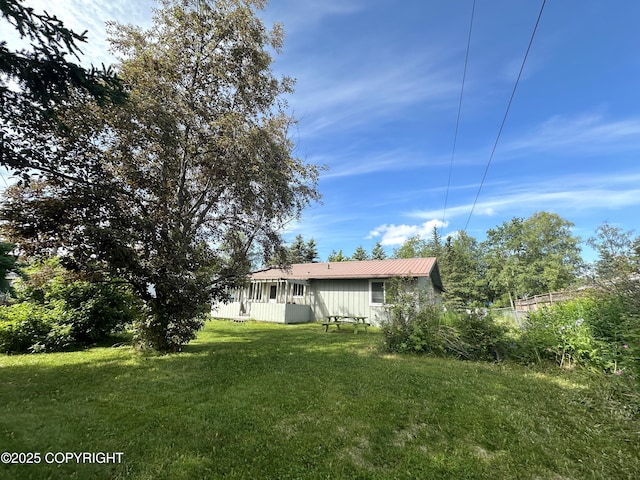 108 S Leibrock St, Soldotna, AK 99669 - back of property with a lawn and a metal roof
