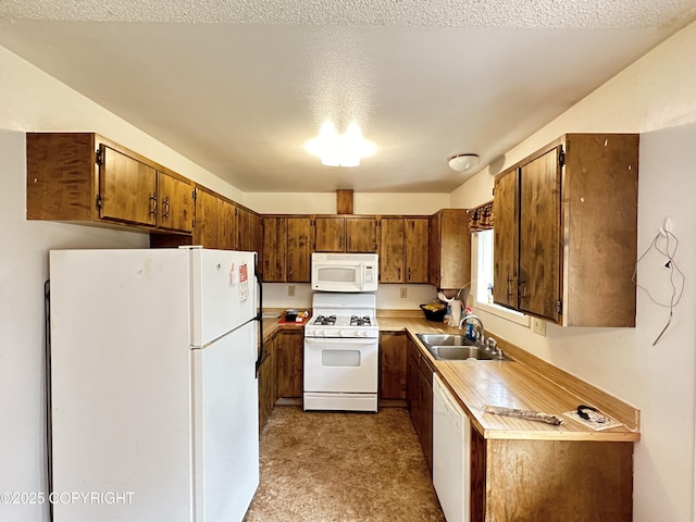 108 S Leibrock St, Soldotna, AK 99669 - kitchen with white appliances, brown cabinets, and light countertops