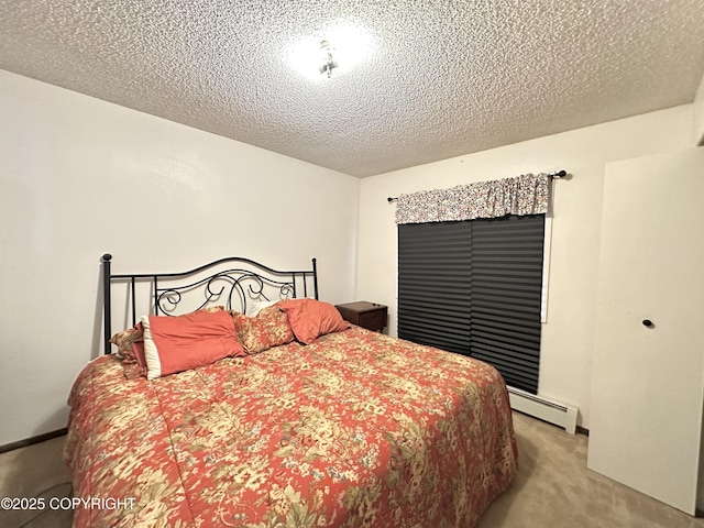 108 S Leibrock St, Soldotna, AK 99669 - bedroom featuring a baseboard heating unit, carpet, and a textured ceiling