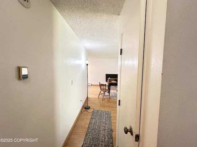 108 S Leibrock St, Soldotna, AK 99669 - hall featuring a textured ceiling, an office area, and light wood finished floors