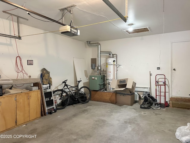 108 S Leibrock St, Soldotna, AK 99669 - garage with water heater and a garage door opener