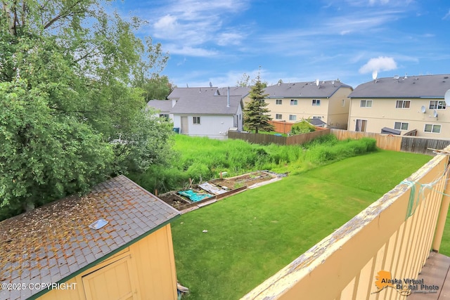 1710 Rierie Dr, Anchorage, AK 99507 - fenced backyard with a residential view