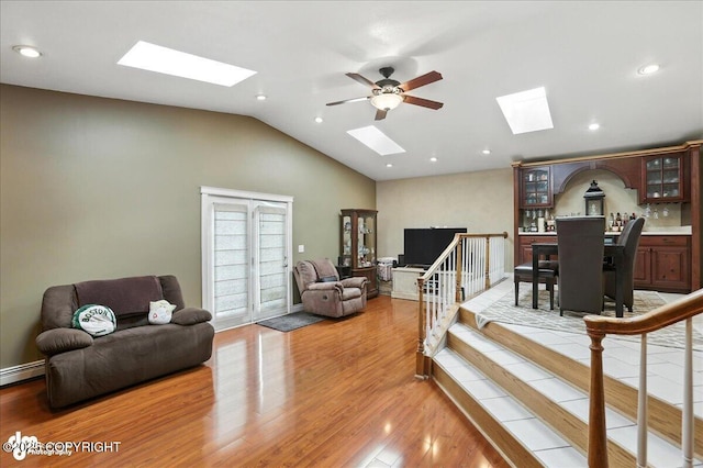 1801 Rebel Ridge Dr, Anchorage, AK 99504 - living area with a skylight, light wood-style floors, ceiling fan, recessed lighting, and high vaulted ceiling