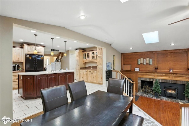 1801 Rebel Ridge Dr, Anchorage, AK 99504 - dining area with recessed lighting, a skylight, a wood stove, and light tile patterned floors