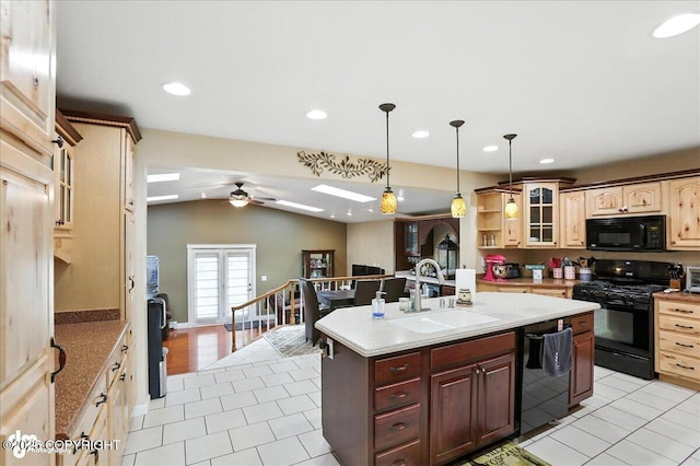 1801 Rebel Ridge Dr, Anchorage, AK 99504 - kitchen with black appliances, light tile patterned flooring, a ceiling fan, a kitchen island with sink, and recessed lighting