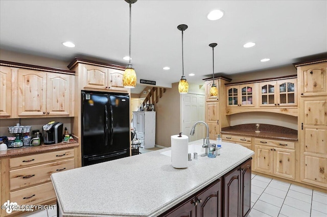 1801 Rebel Ridge Dr, Anchorage, AK 99504 - kitchen featuring freestanding refrigerator, a kitchen island with sink, light brown cabinetry, and recessed lighting