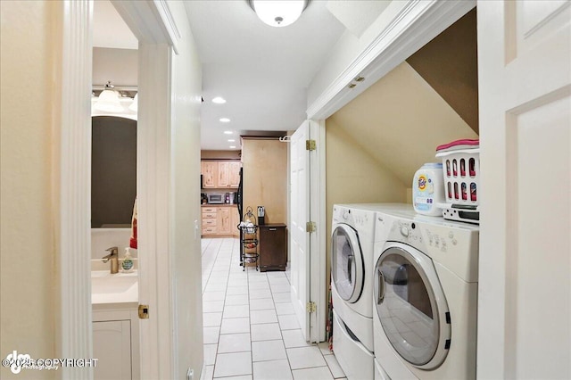 1801 Rebel Ridge Dr, Anchorage, AK 99504 - laundry area featuring light tile patterned flooring, separate washer and dryer, and recessed lighting