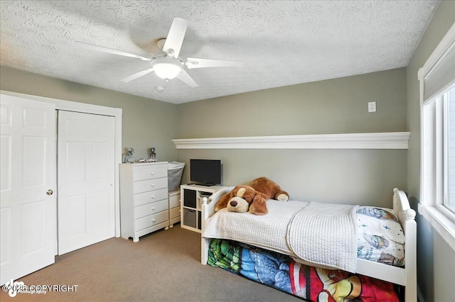 1801 Rebel Ridge Dr, Anchorage, AK 99504 - carpeted bedroom featuring ceiling fan, a textured ceiling, and a closet