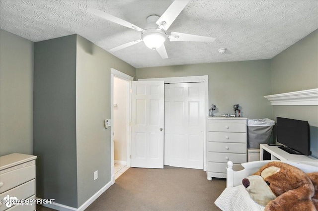 1801 Rebel Ridge Dr, Anchorage, AK 99504 - bedroom featuring carpet floors, a closet, a textured ceiling, and a ceiling fan