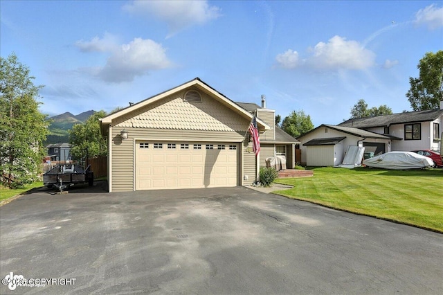 1801 Rebel Ridge Dr, Anchorage, AK 99504 - view of front of home with driveway, a front yard, a garage, and a chimney