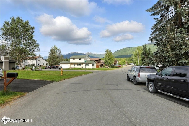 1801 Rebel Ridge Dr, Anchorage, AK 99504 - view of asphalt street featuring a mountain view and a residential view