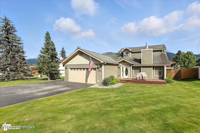1801 Rebel Ridge Dr, Anchorage, AK 99504 - view of front of home featuring driveway, a garage, and a deck