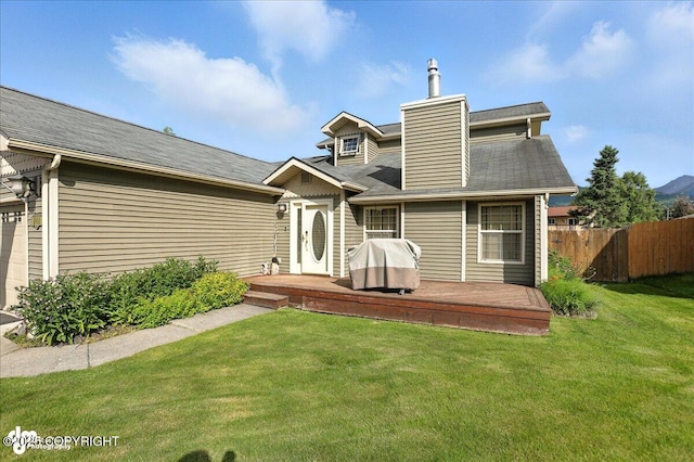 1801 Rebel Ridge Dr, Anchorage, AK 99504 - rear view of house featuring a deck and a chimney