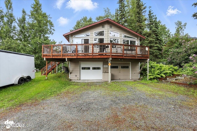 10845 Anvik Cir, Eagle River, AK 99577 - rear view of property featuring driveway, a deck, stairway, and an attached garage